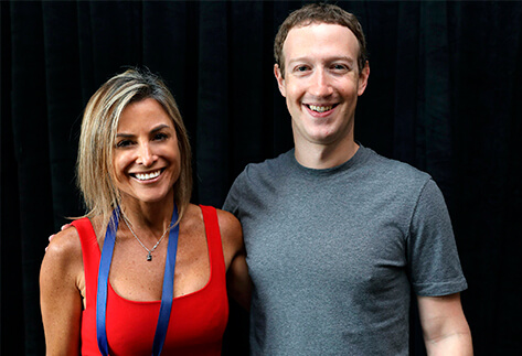 Silvina Moschini, a co-founder and the President of TransparentBusiness, with Mark Zuckerberg, the founder of Facebook. TransparentBusiness is a technology partner of Facebook.